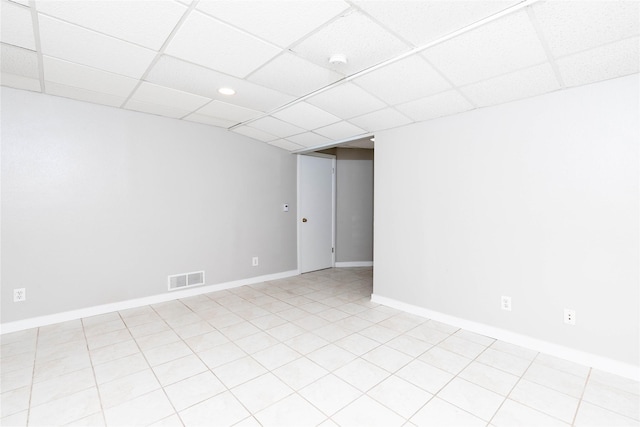 empty room featuring recessed lighting, visible vents, a drop ceiling, and baseboards