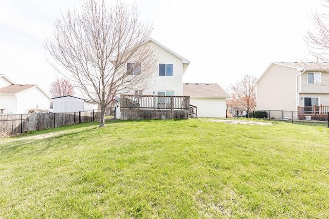 view of yard with fence and a deck