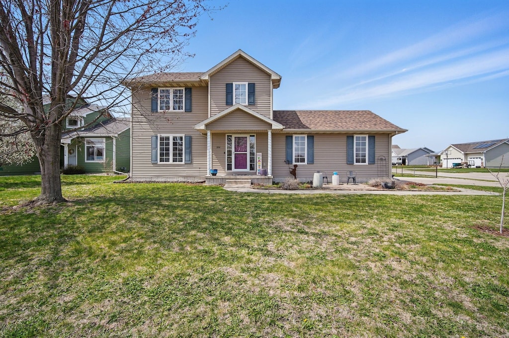 204 Mallard Pointe Dr NW, Bondurant, IA 50035 - view of front of home featuring roof with shingles and a front yard