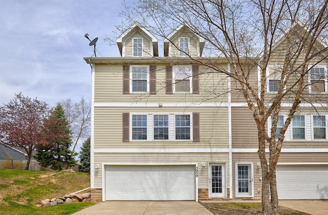 view of front of home with a garage and concrete driveway