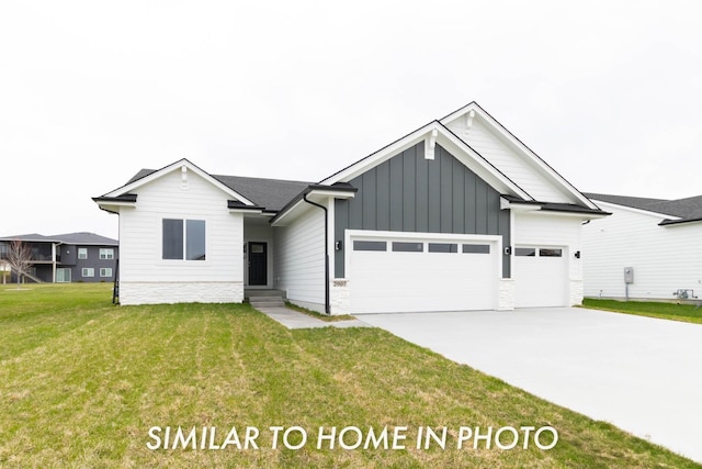 10123 NW 68th Ave, Johnston, IA 50131 - view of front of house with a front yard, an attached garage, board and batten siding, and concrete driveway