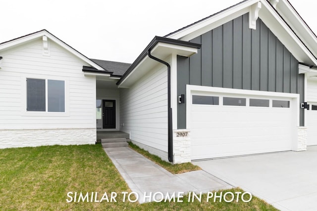 10123 NW 68th Ave, Johnston, IA 50131 - modern inspired farmhouse with board and batten siding, a front yard, driveway, and a garage