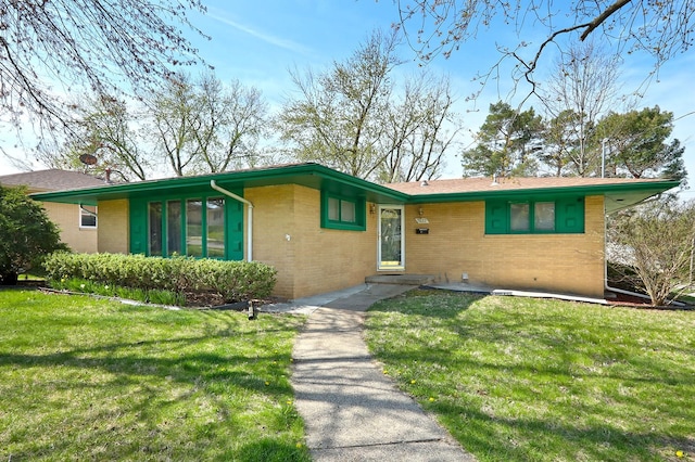 7422 Oak Brook Dr, Urbandale, IA 50322 - view of front facade with a front lawn and brick siding