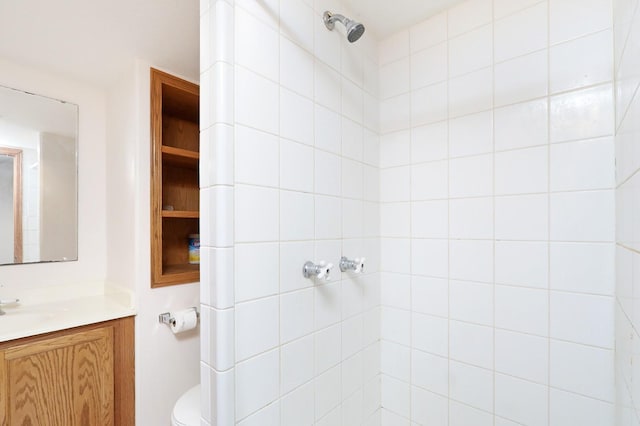 7422 Oak Brook Dr, Urbandale, IA 50322 - bathroom featuring vanity, toilet, and tiled shower