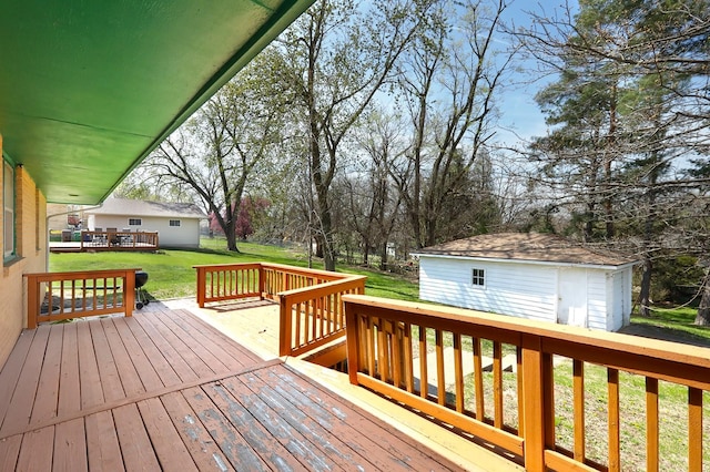 7422 Oak Brook Dr, Urbandale, IA 50322 - deck with a lawn and an outdoor structure