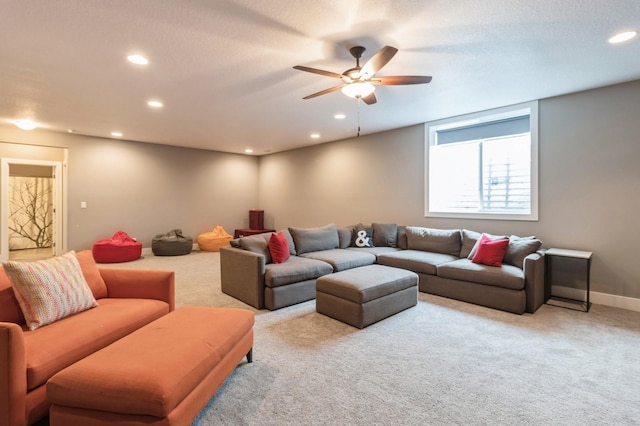 carpeted living room with recessed lighting, a ceiling fan, and baseboards