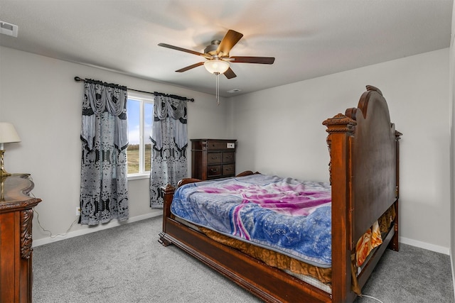 carpeted bedroom featuring visible vents, baseboards, and ceiling fan