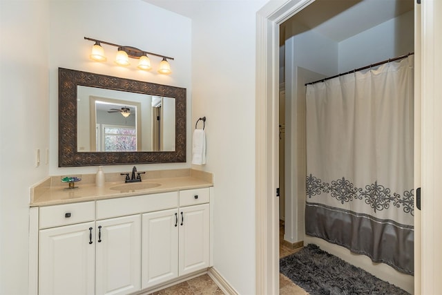 bathroom with vanity and curtained shower