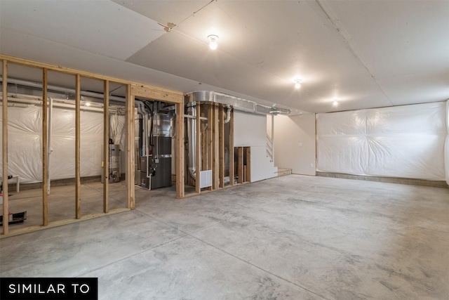 4408 NE 8th St, Ankeny, IA 50021 - unfinished below grade area featuring stairway, heating unit, and gas water heater