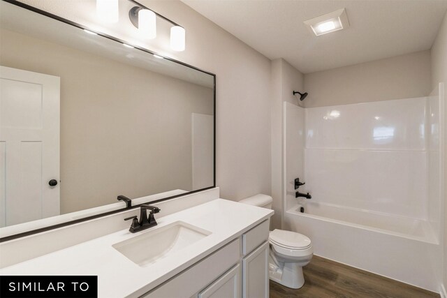 4408 NE 8th St, Ankeny, IA 50021 - bathroom featuring shower / bathtub combination, wood finished floors, vanity, and toilet