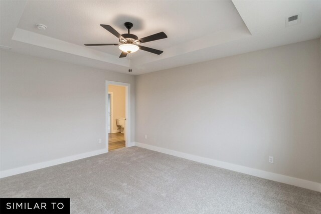 4408 NE 8th St, Ankeny, IA 50021 - unfurnished room featuring a ceiling fan, visible vents, a raised ceiling, and light colored carpet