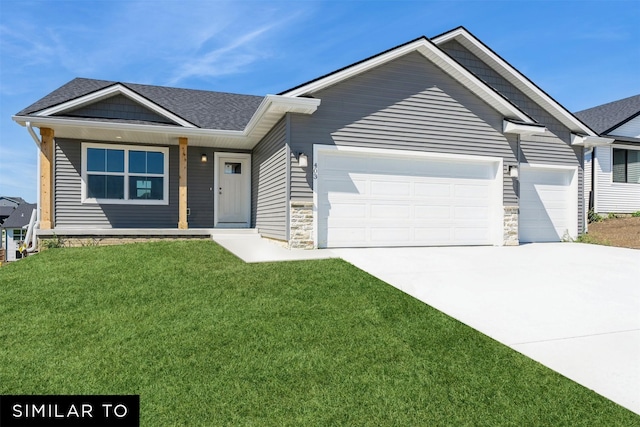 4412 NE 8th St, Ankeny, IA 50021 - view of front of house with stone siding, concrete driveway, a front yard, and a garage