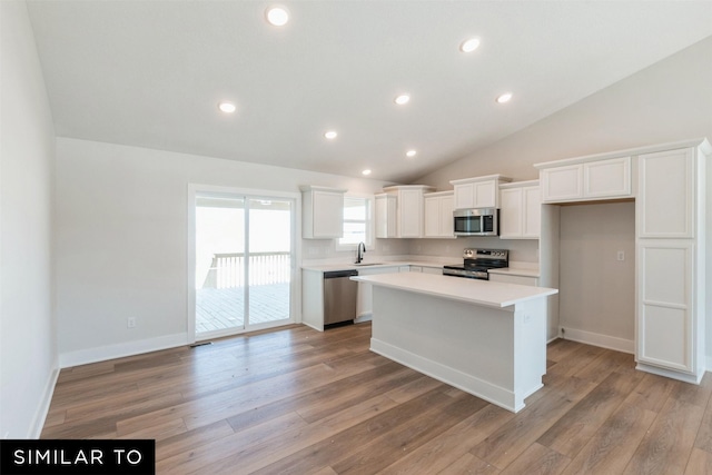 4412 NE 8th St, Ankeny, IA 50021 - kitchen with white cabinets, light wood-style flooring, appliances with stainless steel finishes, and a sink