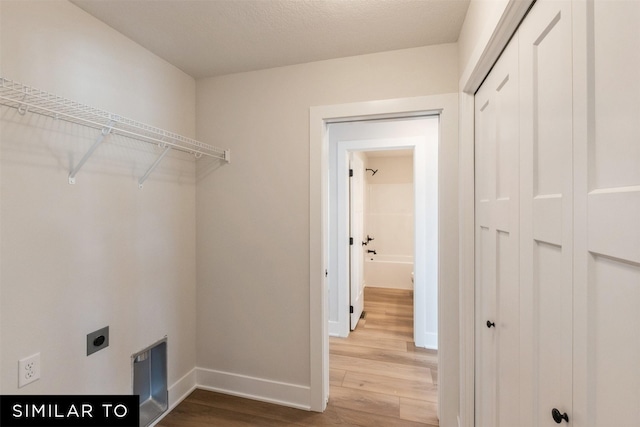 4412 NE 8th St, Ankeny, IA 50021 - laundry room with hookup for an electric dryer, laundry area, baseboards, and wood finished floors