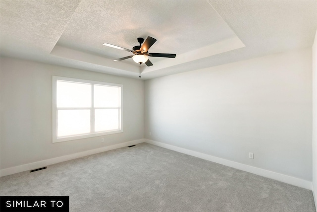 4412 NE 8th St, Ankeny, IA 50021 - empty room with carpet, baseboards, visible vents, and a raised ceiling