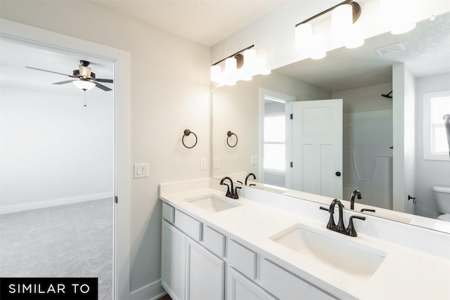 4412 NE 8th St, Ankeny, IA 50021 - bathroom featuring a healthy amount of sunlight, toilet, and a sink
