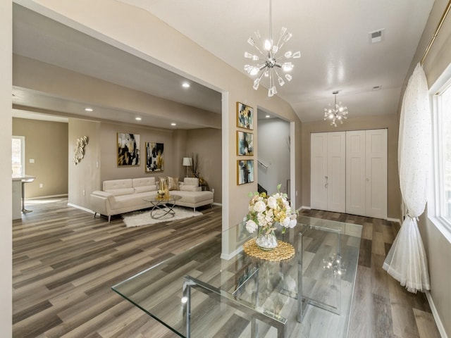 1710 Forest Ave, Des Moines, IA 50314 - interior space featuring wood finished floors, a chandelier, baseboards, visible vents, and recessed lighting