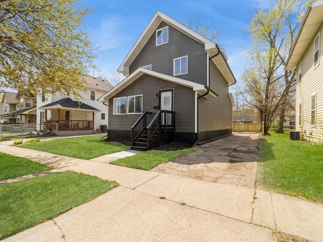 1710 Forest Ave, Des Moines, IA 50314 - view of front of property with a front lawn, driveway, and central air condition unit