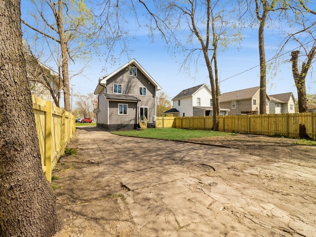 1710 Forest Ave, Des Moines, IA 50314 - rear view of property featuring a fenced backyard and a lawn