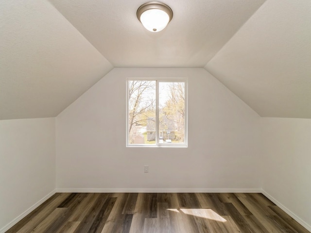 1710 Forest Ave, Des Moines, IA 50314 - bonus room featuring vaulted ceiling, wood finished floors, and baseboards