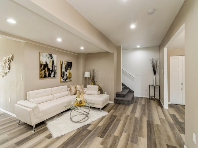 1710 Forest Ave, Des Moines, IA 50314 - living area with wood finished floors, recessed lighting, and stairs