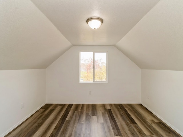 1710 Forest Ave, Des Moines, IA 50314 - additional living space featuring lofted ceiling, baseboards, and wood finished floors