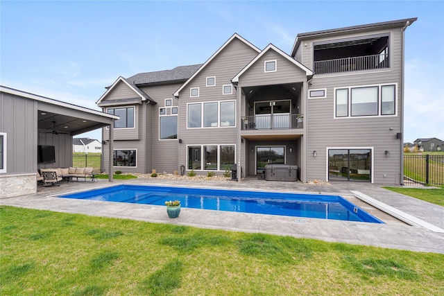 3815 NW 183rd St, Clive, IA 50325 - rear view of house featuring a jacuzzi, outdoor lounge area, a balcony, and a patio area