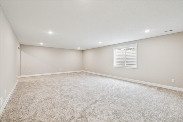 2311 N 8th Ave E, Newton, IA 50208 - unfurnished room featuring carpet and recessed lighting
