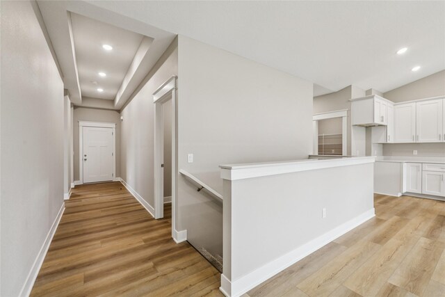 2311 N 8th Ave E, Newton, IA 50208 - hallway featuring light wood finished floors and recessed lighting
