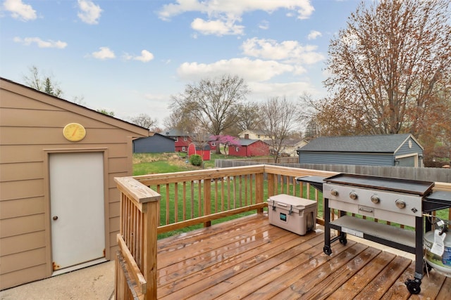 deck featuring fence and a yard