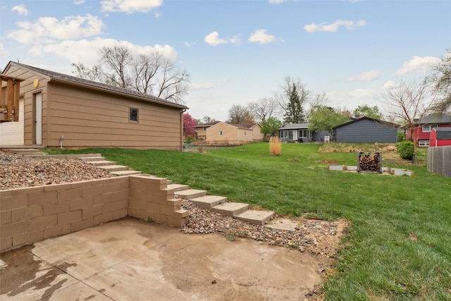 view of yard with fence and a patio