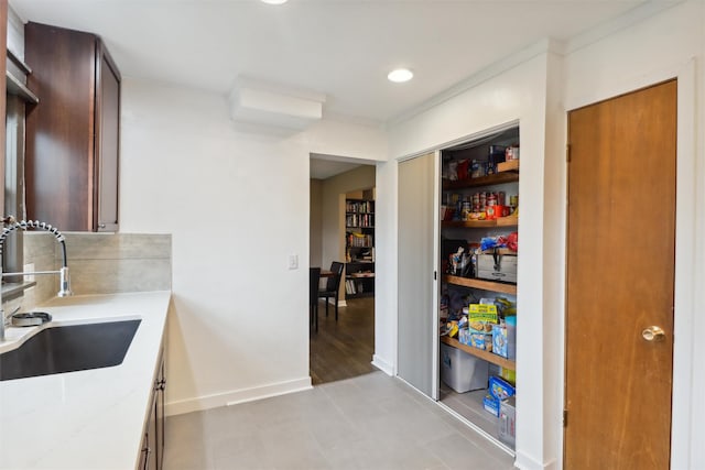 pantry with a sink