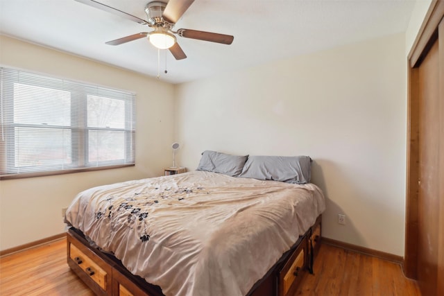 7300 Prairie Ave, Urbandale, IA 50322 - bedroom with light wood finished floors, a closet, and ceiling fan