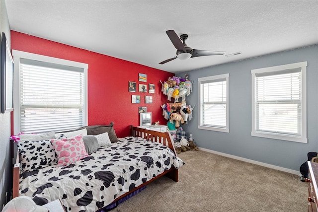 2307 SE 17th St, Ankeny, IA 50021 - bedroom featuring a textured ceiling, ceiling fan, carpet floors, baseboards, and visible vents