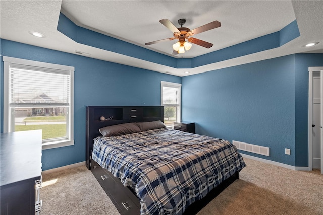 2307 SE 17th St, Ankeny, IA 50021 - bedroom with a raised ceiling, visible vents, and carpet