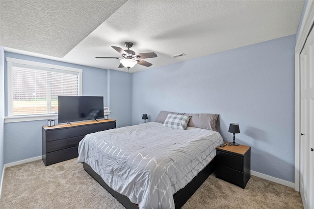 2307 SE 17th St, Ankeny, IA 50021 - bedroom with light carpet, a textured ceiling, and visible vents
