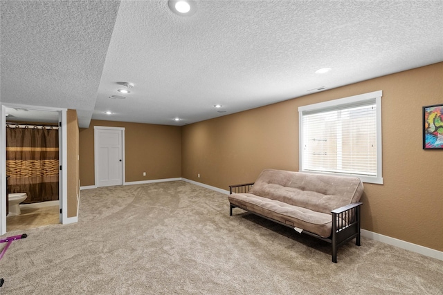 2307 SE 17th St, Ankeny, IA 50021 - living area with baseboards, carpet flooring, a textured ceiling, and recessed lighting
