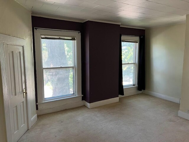 842 16th St Unit 4, Des Moines, IA 50314 - carpeted empty room with baseboards and crown molding