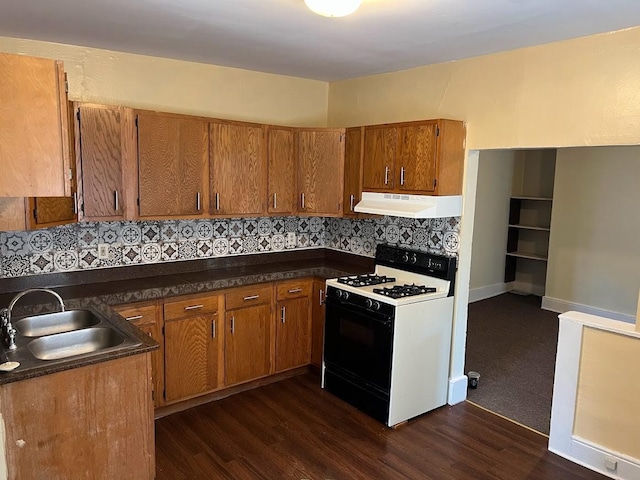 842 16th St Unit 4, Des Moines, IA 50314 - kitchen with range with gas cooktop, extractor fan, brown cabinets, and a sink