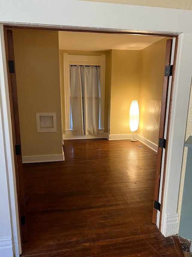 842 16th St Unit 4, Des Moines, IA 50314 - unfurnished room featuring baseboards and hardwood / wood-style floors