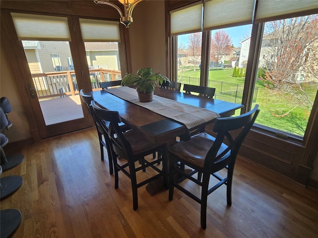 dining area with wood finished floors and a wealth of natural light