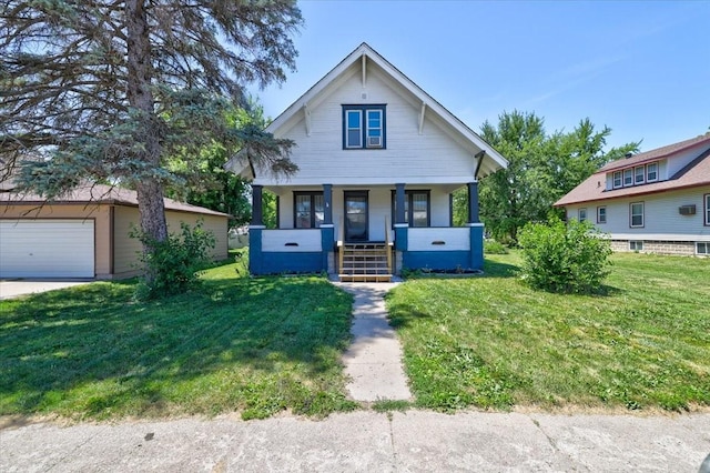 211 Main St S, Melcher-Dallas, IA 50049 - bungalow featuring a porch, a front lawn, and a garage