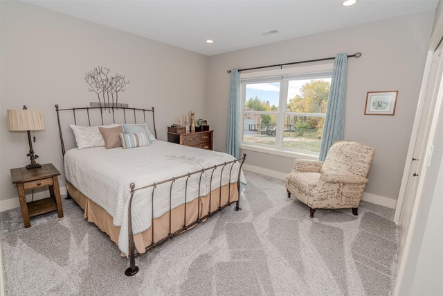 bedroom featuring light carpet, recessed lighting, visible vents, and baseboards