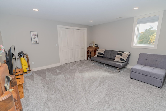 carpeted living room with baseboards and recessed lighting
