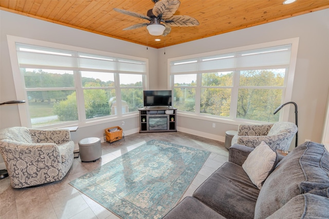 living room featuring baseboards, recessed lighting, a ceiling fan, wooden ceiling, and light tile patterned floors