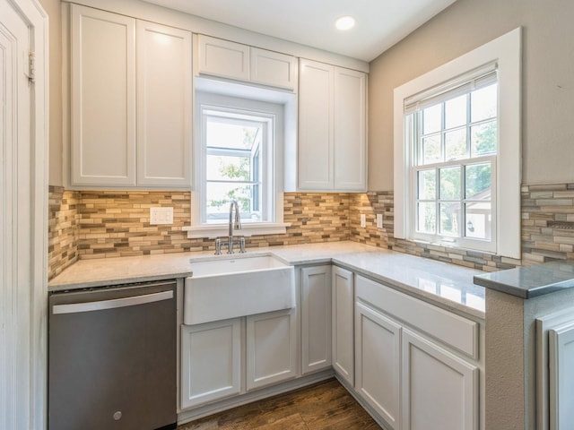 3826 Grand Ave, Des Moines, IA 50312 - kitchen with stainless steel dishwasher, backsplash, white cabinetry, recessed lighting, and dark wood-style flooring
