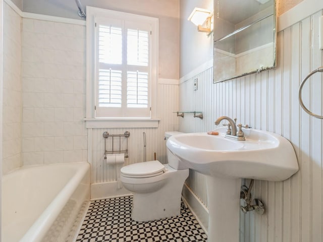 3826 Grand Ave, Des Moines, IA 50312 - full bathroom featuring a wainscoted wall and tile patterned floors