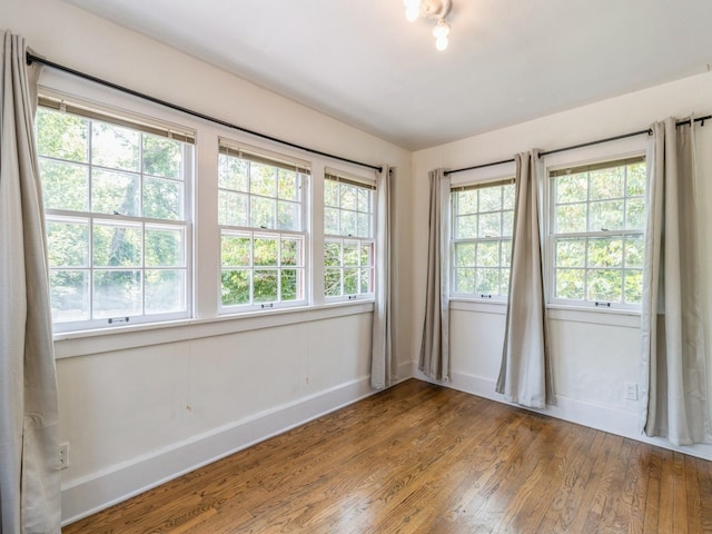 3826 Grand Ave, Des Moines, IA 50312 - empty room with wood finished floors and baseboards