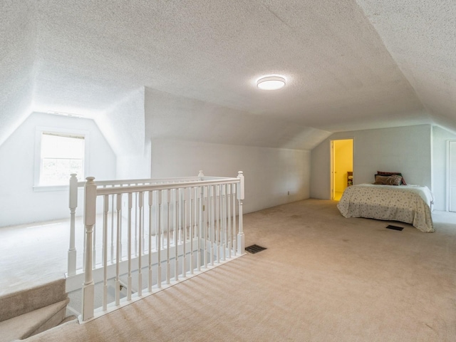 3826 Grand Ave, Des Moines, IA 50312 - bedroom with carpet flooring, lofted ceiling, and a textured ceiling