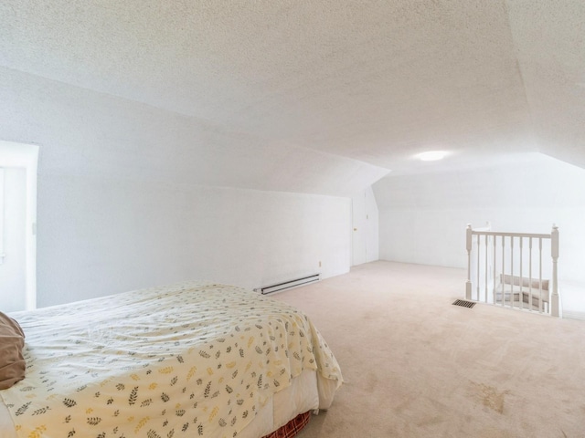3826 Grand Ave, Des Moines, IA 50312 - carpeted bedroom with a baseboard heating unit, lofted ceiling, and a textured ceiling